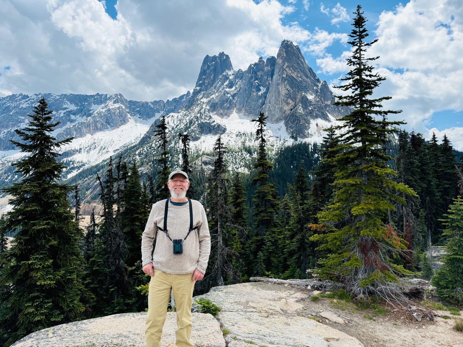 Mike Hamilton with binoculars in the North Cascades